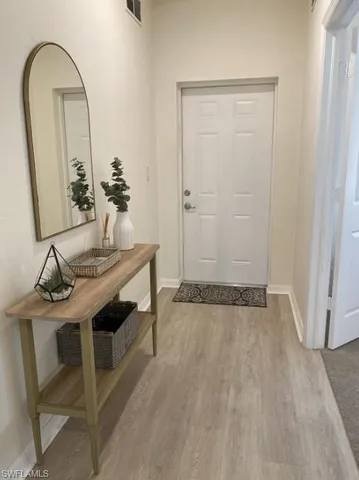 a view of room with a sink and mirror