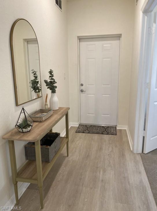 4430 Botanical Pl Circle, Unit 303 Naples, FL 34112 - Photo 6 of 22 a view of room with a sink and mirror