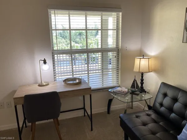 a room with furniture and a window