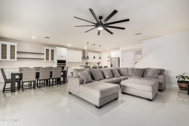 a kitchen with stainless steel appliances kitchen island a stove and a sink