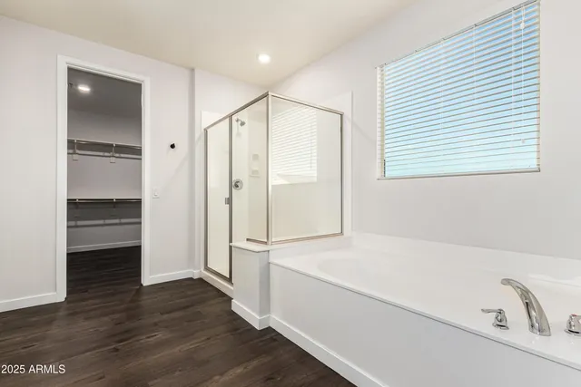 a bathroom with a bathtub and a shower