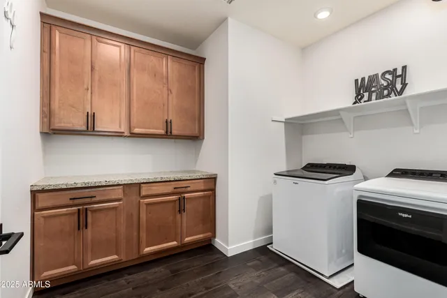 a living room with furniture and a ceiling fan