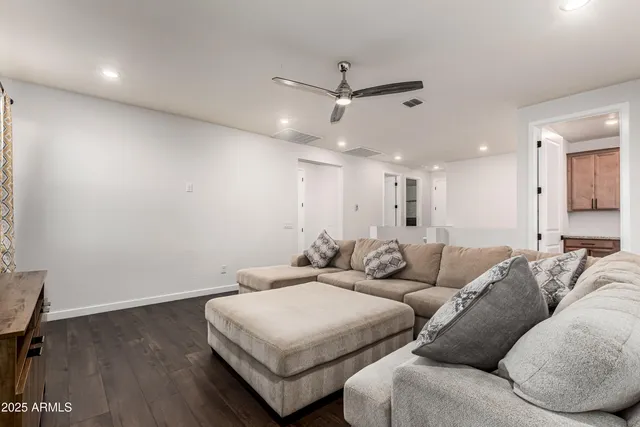 a living room with furniture and a rug
