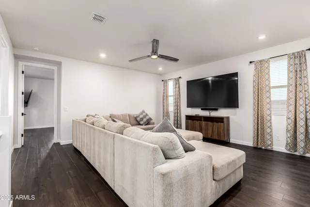 a large kitchen with a table and chairs