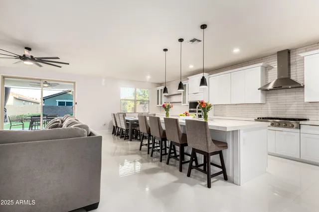 a kitchen with refrigerator and cabinets