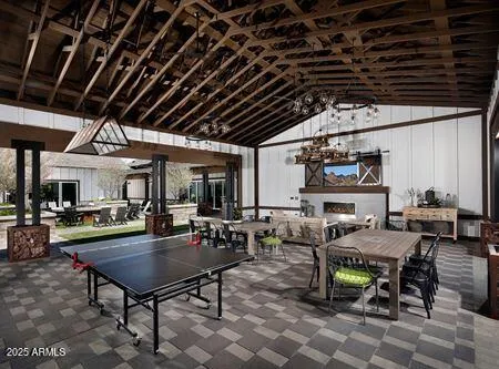 a view of swimming pool with outdoor seating