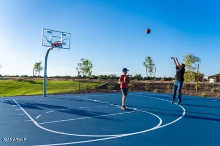a view of a white house with a yard and plants