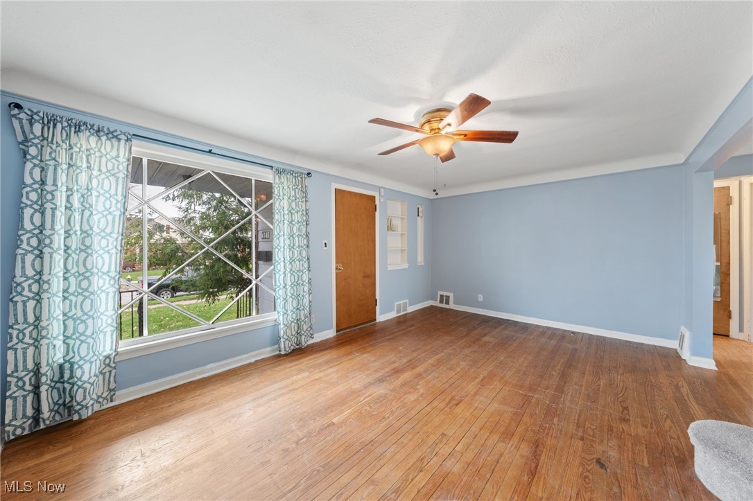 4146 Wyncote Road South Euclid, OH 44121 - Photo 3 of 20 Living room with hardwood floor large picture window and ceiling fan