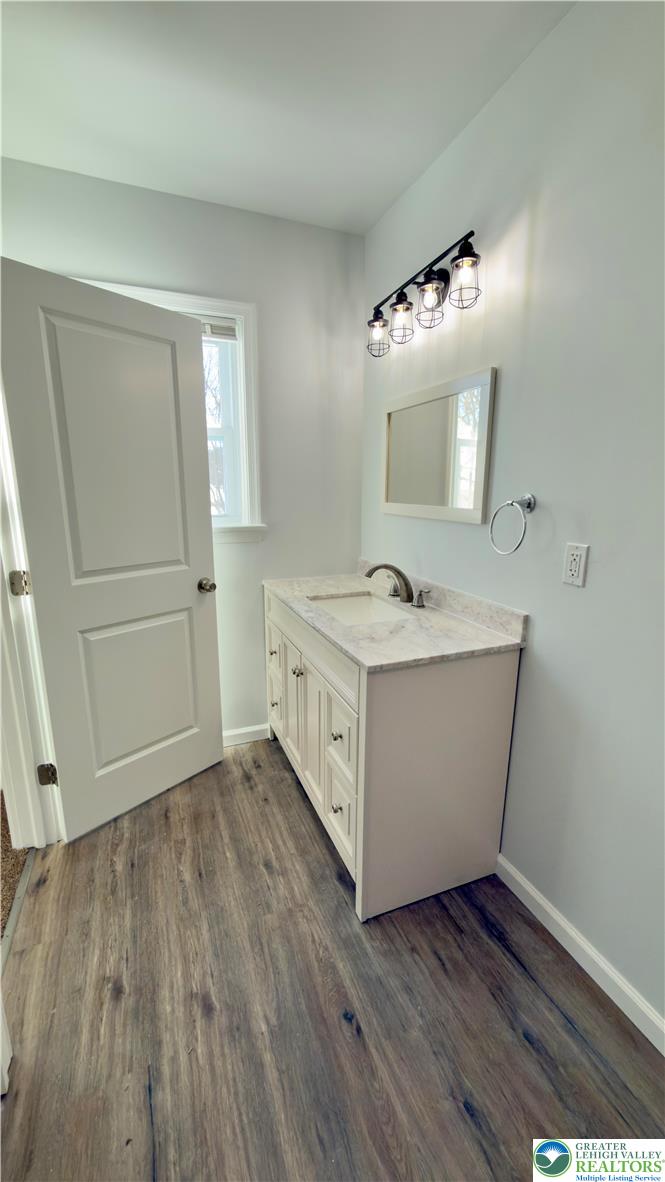 403 North Walnut Street, Unit B Bath, PA 18014 - Photo 18 of 31 a bathroom with a double vanity sink and mirror