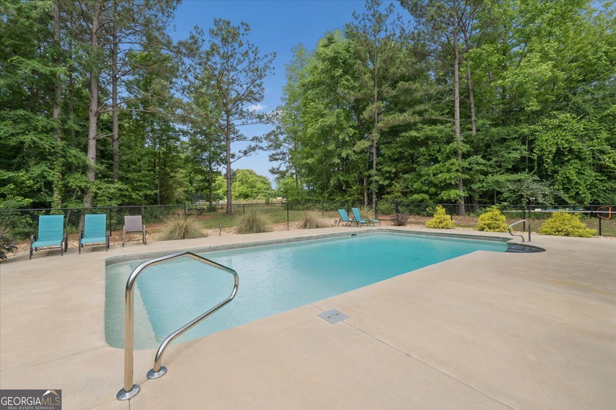 683 Teagle Road Forsyth, GA 31029 - Photo 34 of 50 a view of swimming pool with a yard