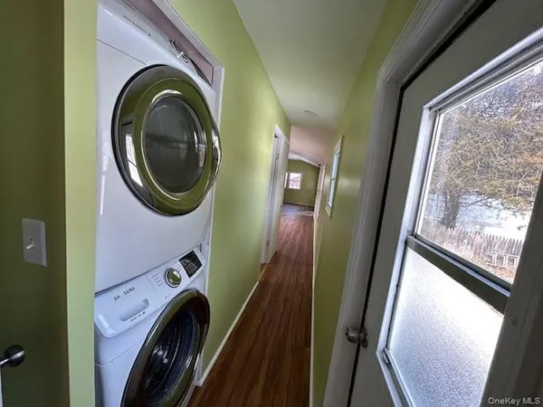a view of a hallway with washer and dryer