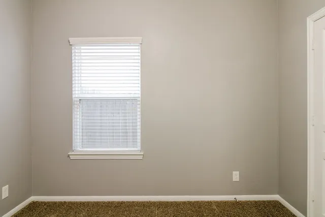 a view of wooden floor and a window