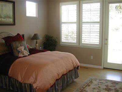 1461 Hawk Crest Place Santa Rosa, CA 95409 - Photo 6 of 9 a bed sitting in a bedroom next to a window
