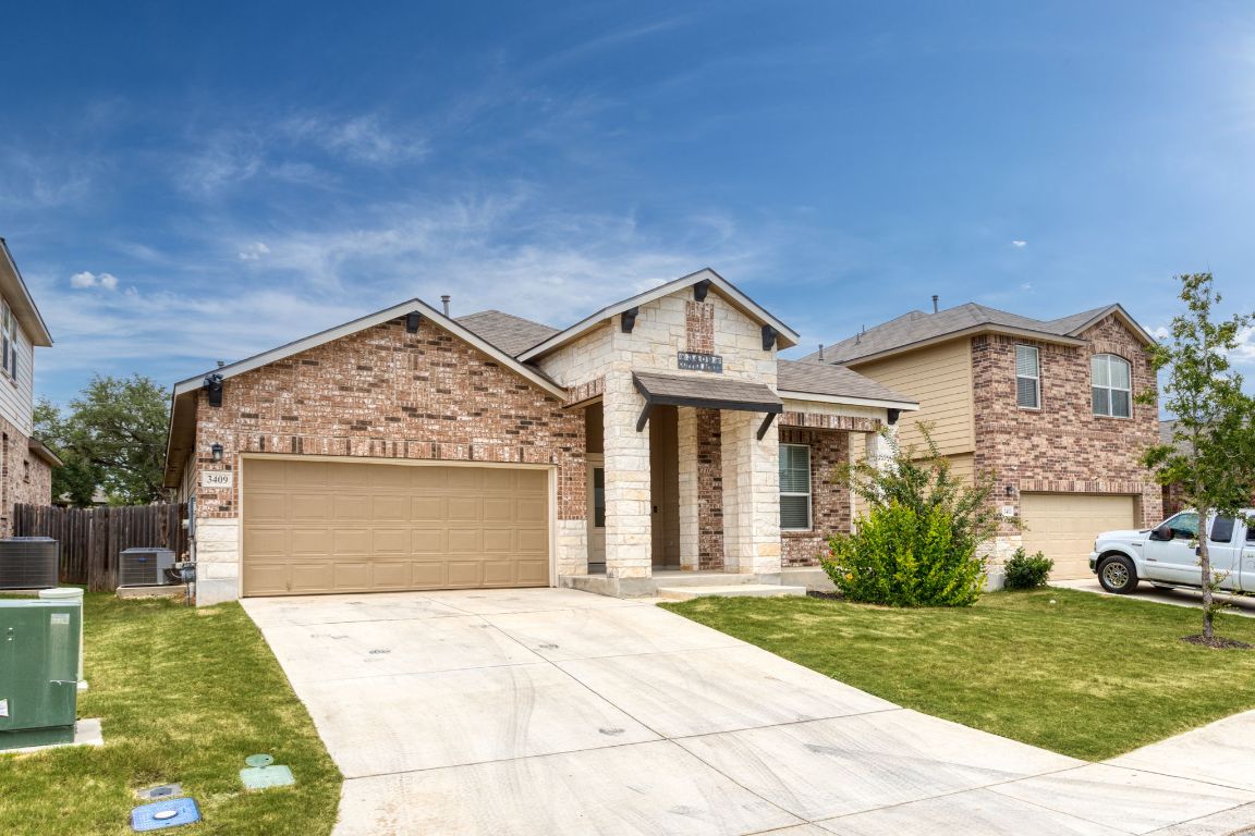 3409 Copper Acres Bulverde, TX 78163 - Photo 2 of 23 a front view of a house with garden
