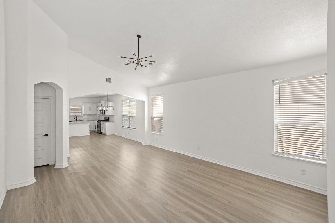 3409 Copper Acres Bulverde, TX 78163 - Photo 3 of 23 a view of a livingroom with wooden floor and a ceiling fan