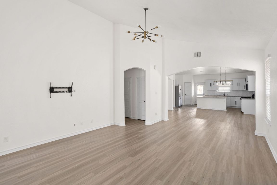 3409 Copper Acres Bulverde, TX 78163 - Photo 4 of 23 a view of a kitchen with wooden floor and a large window