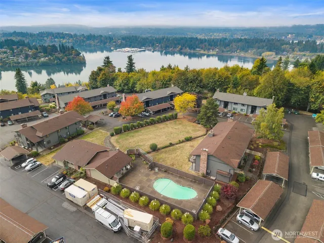 an aerial view of residential houses with outdoor space
