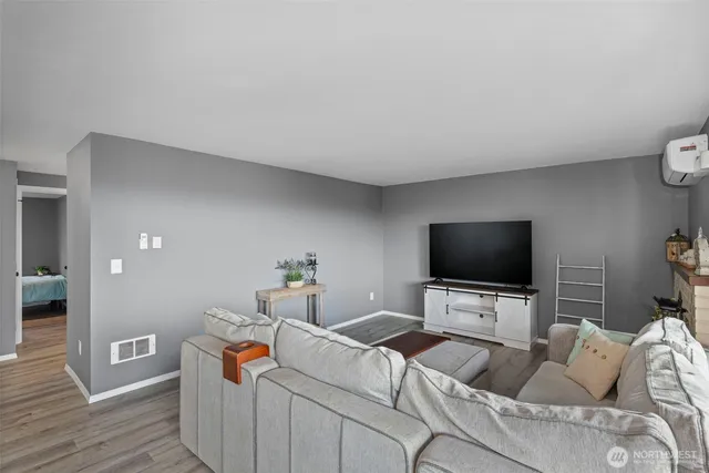 a balcony with furniture and a potted plant