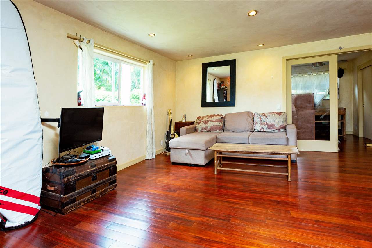 4509 Opana Place Haiku, HI 96708 - Photo 14 of 26 a living room with furniture and a flat screen tv