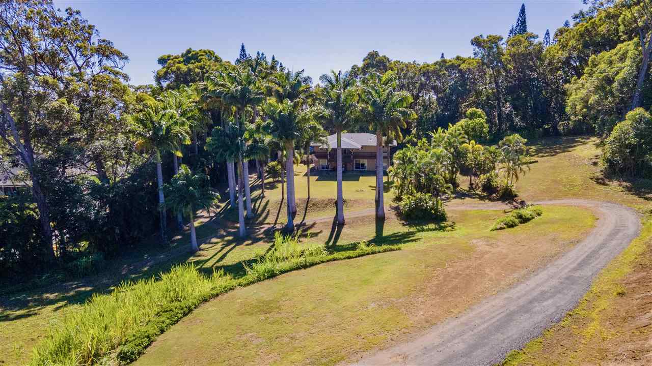 4509 Opana Place Haiku, HI 96708 - Photo 5 of 26 a view of a swimming pool with a yard