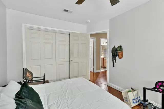 a bedroom with a bed and cabinets