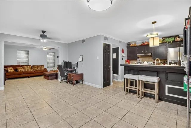 a living room with furniture a table and chairs