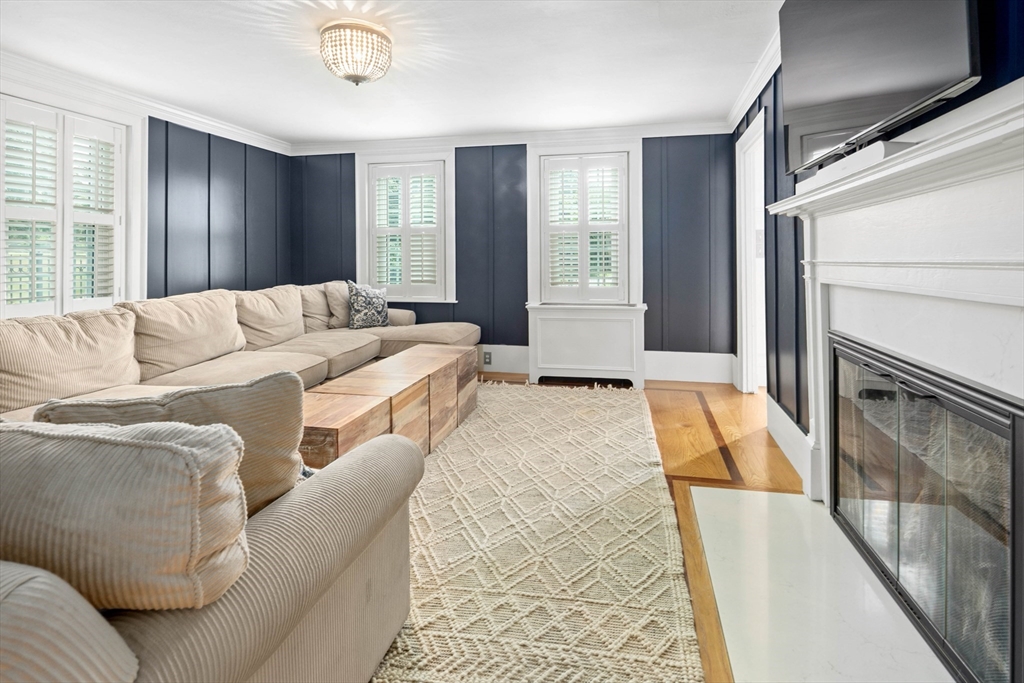 17 Common Street Scituate, MA 02066 - Photo 14 of 39 a living room with furniture and a fireplace