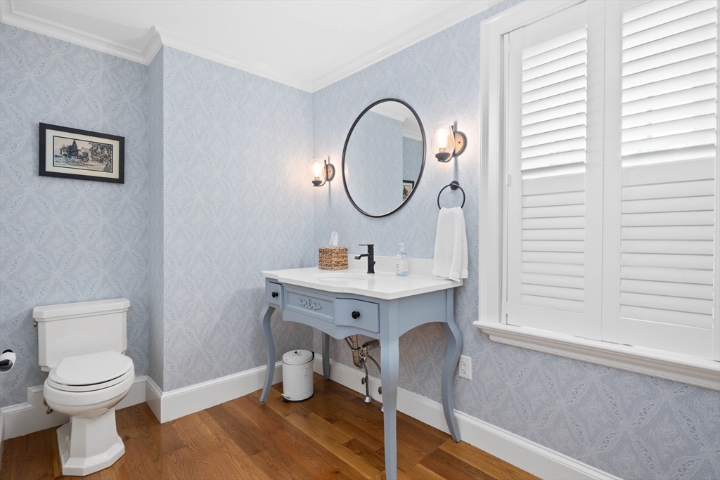 17 Common Street Scituate, MA 02066 - Photo 15 of 39 a bathroom with a toilet a sink and a mirror