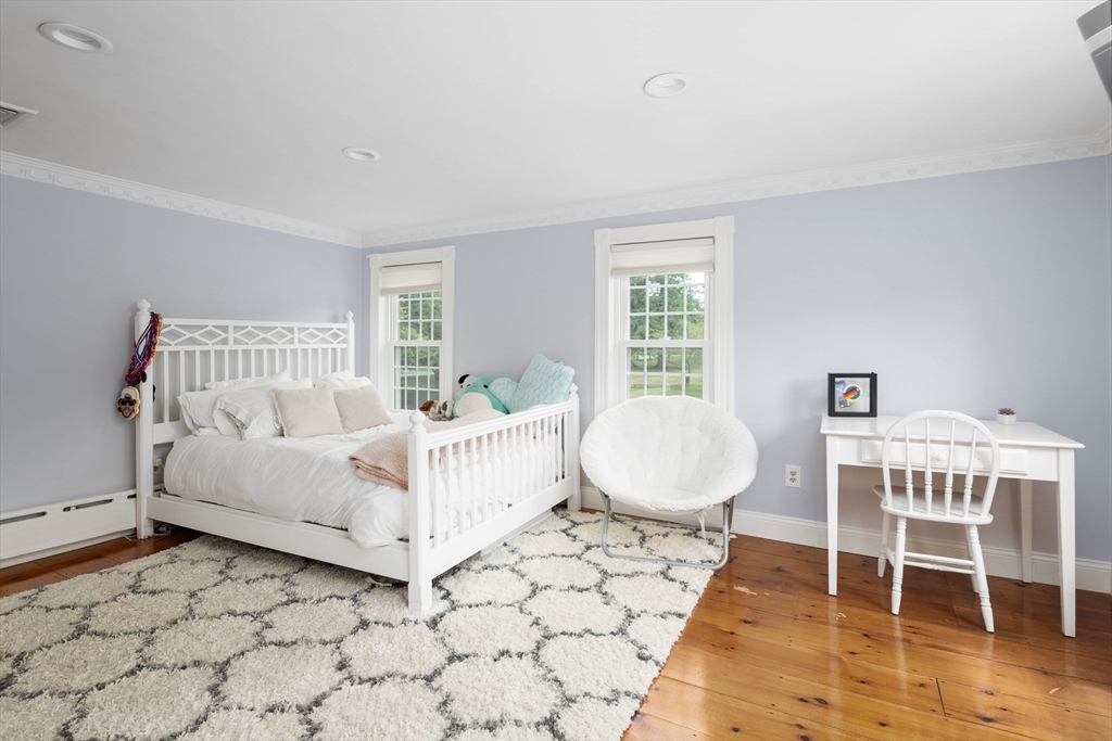 17 Common Street Scituate, MA 02066 - Photo 17 of 39 a bed room with a bed and a window