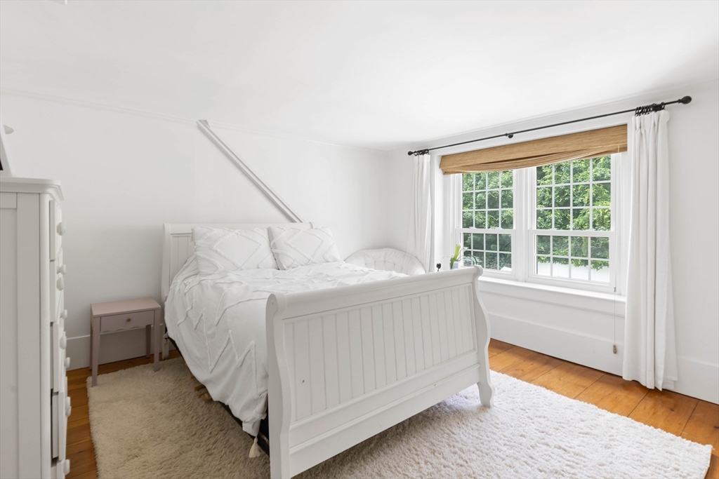 17 Common Street Scituate, MA 02066 - Photo 19 of 39 a bedroom with a bed and a window