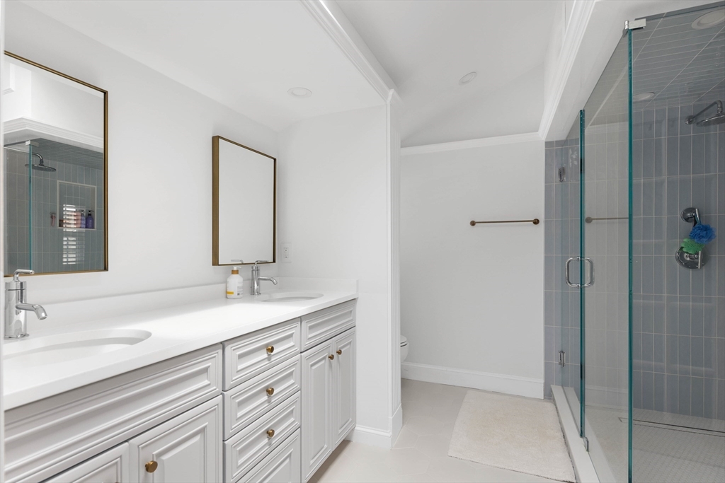 17 Common Street Scituate, MA 02066 - Photo 22 of 39 a bathroom with a sink and a mirror