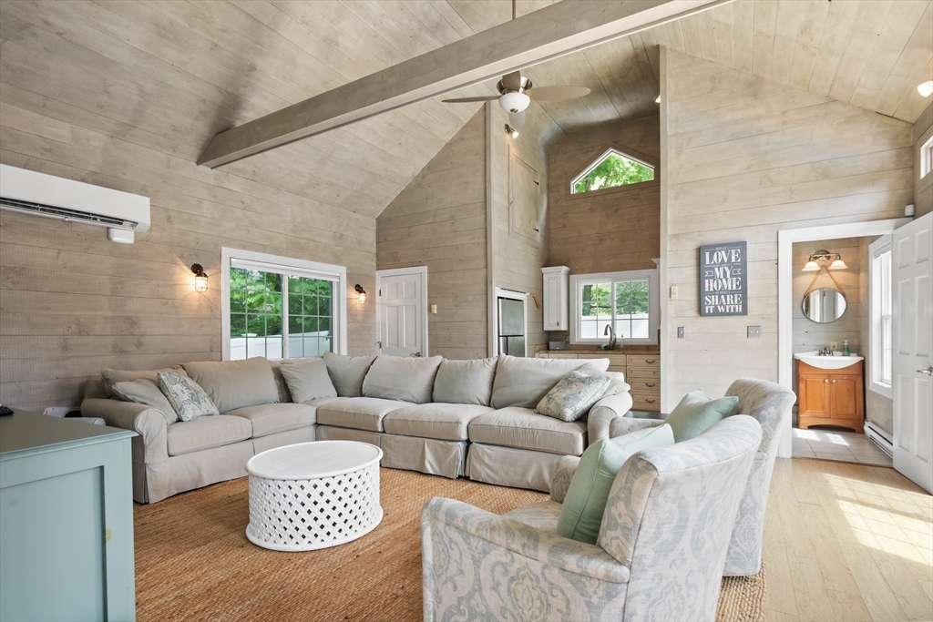 17 Common Street Scituate, MA 02066 - Photo 34 of 39 a living room with furniture and a wooden floor