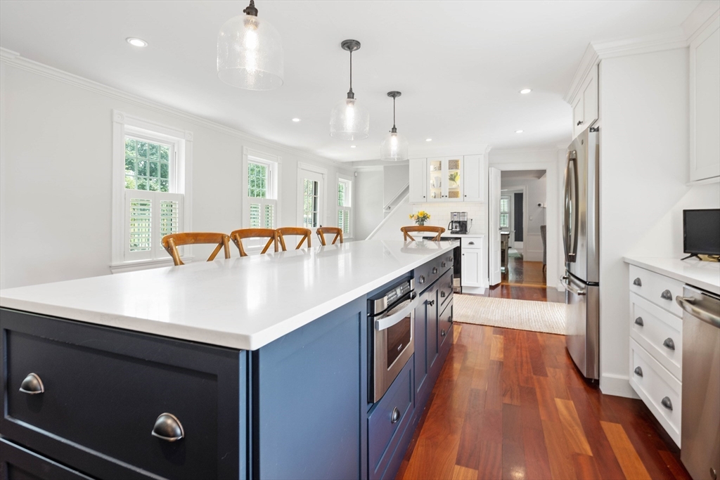 17 Common Street Scituate, MA 02066 - Photo 4 of 39 a kitchen with stainless steel appliances granite countertop a sink a stove and a refrigerator