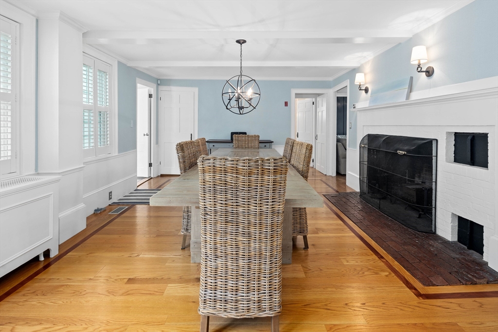 17 Common Street Scituate, MA 02066 - Photo 7 of 39 a living room with furniture and a fireplace