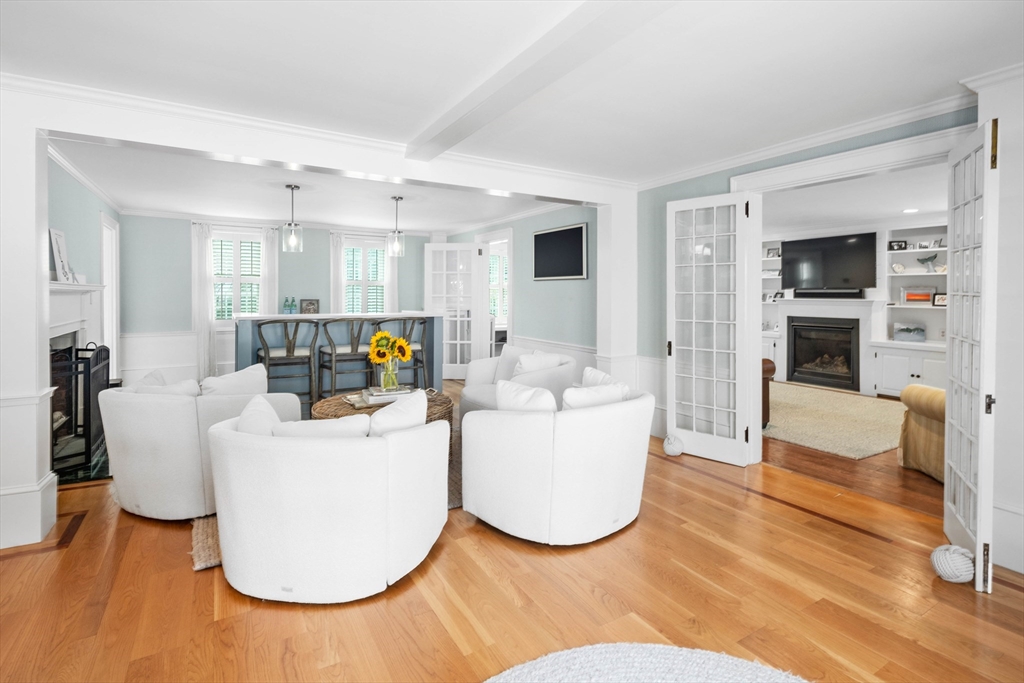 17 Common Street Scituate, MA 02066 - Photo 8 of 39 a living room with furniture and a fireplace