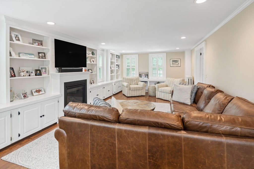 17 Common Street Scituate, MA 02066 - Photo 10 of 39 a living room with furniture fireplace and flat screen tv