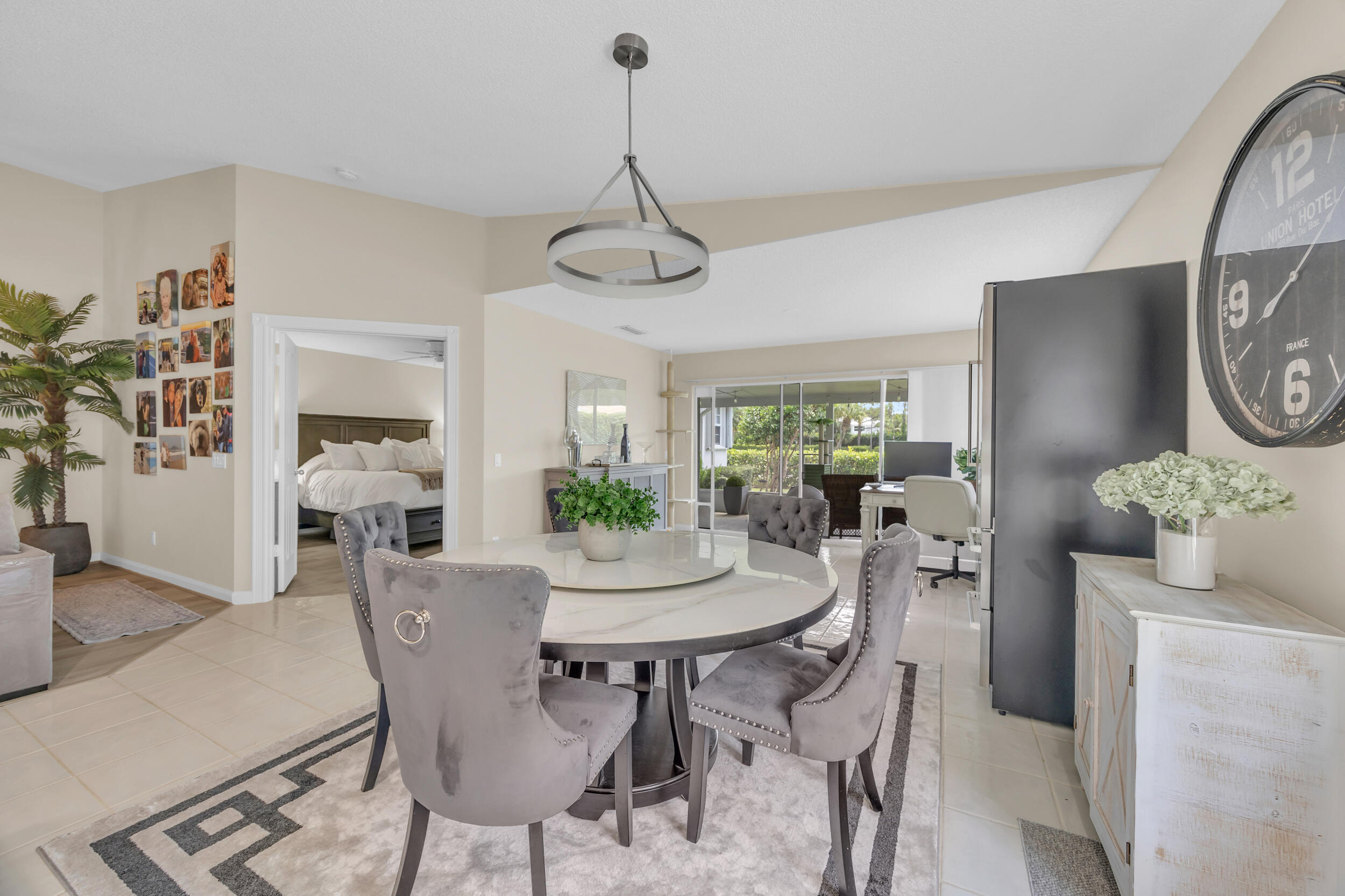 233 Brier Circle Jupiter, FL 33458 - Photo 11 of 31 a view of a dining room with furniture window and wooden floor