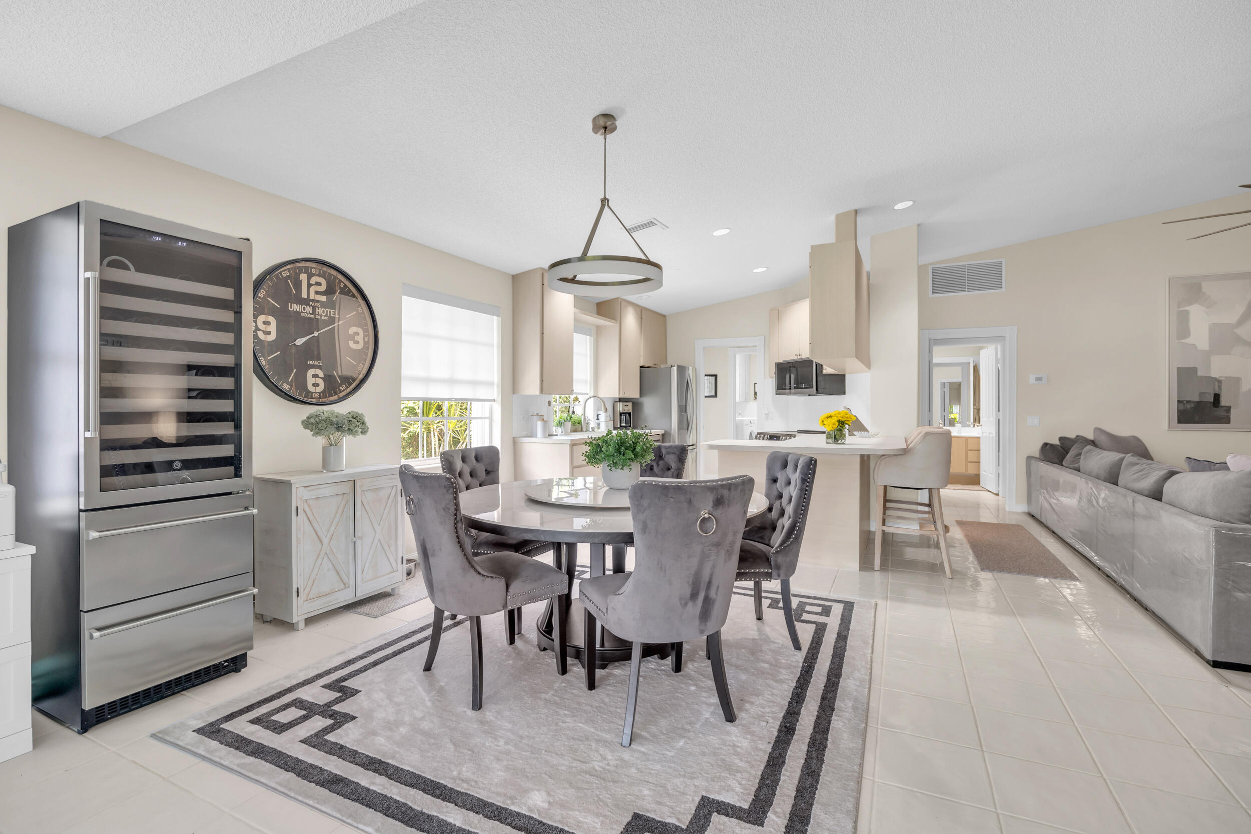 233 Brier Circle Jupiter, FL 33458 - Photo 12 of 31 a view of a dining room with furniture window and wooden floor