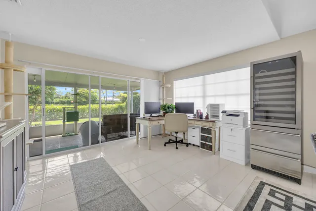 a room with furniture a rug and a window