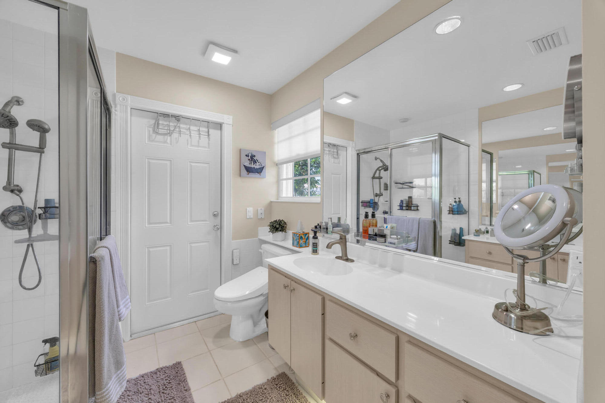 233 Brier Circle Jupiter, FL 33458 - Photo 20 of 31 a bathroom with a sink a toilet and shower