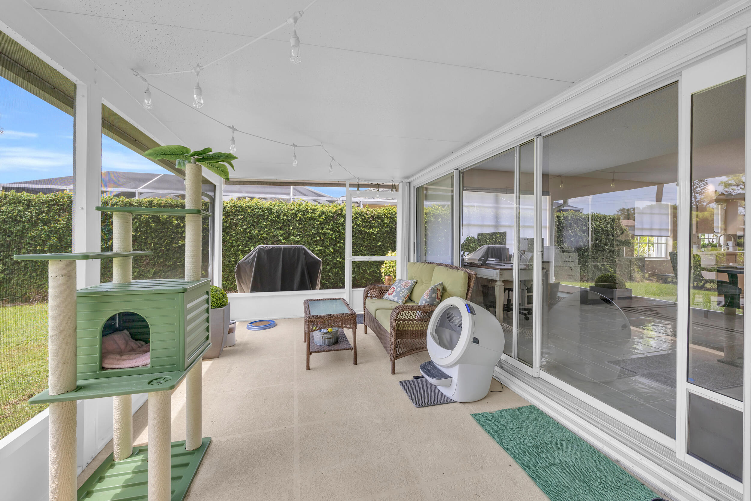 233 Brier Circle Jupiter, FL 33458 - Photo 27 of 31 a living room filled with furniture and garden