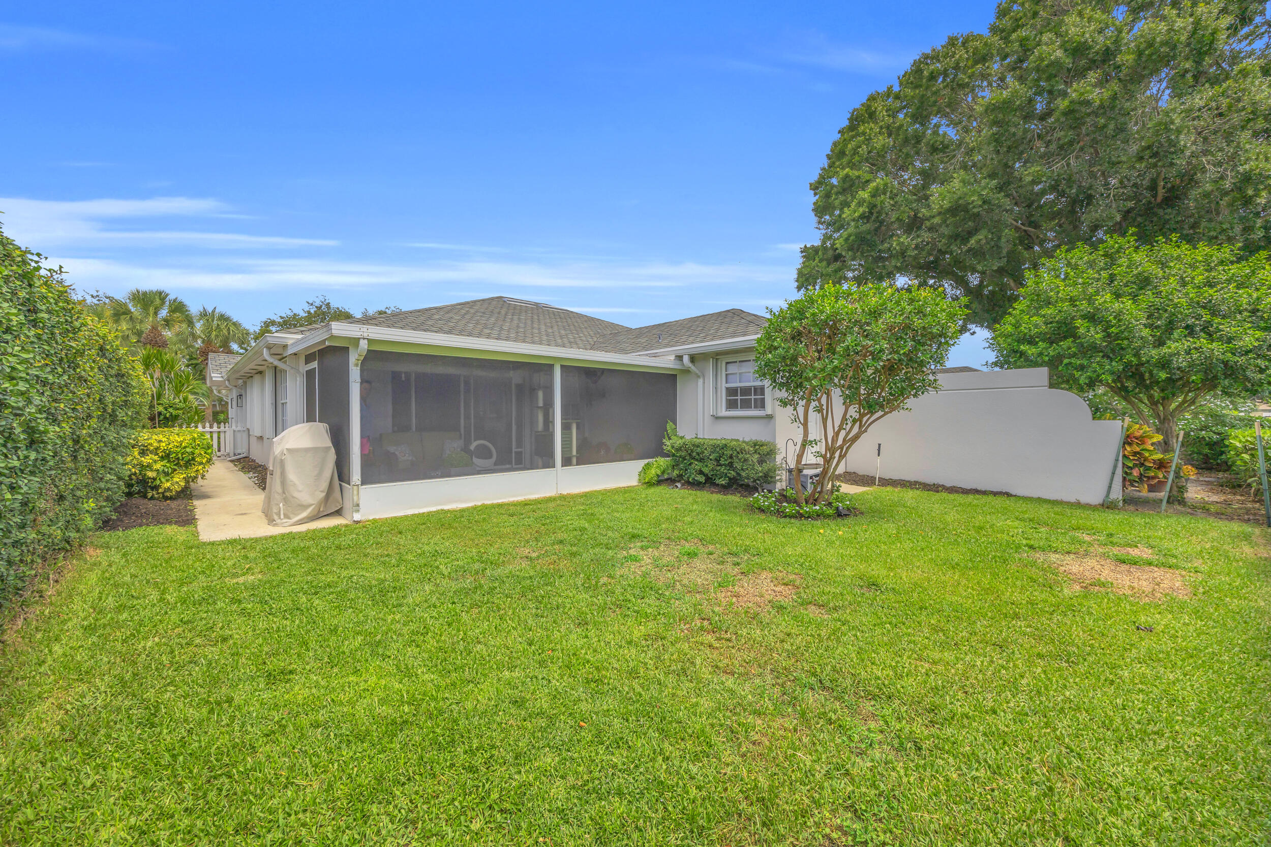 233 Brier Circle Jupiter, FL 33458 - Photo 29 of 31 a view of a house with backyard and garden