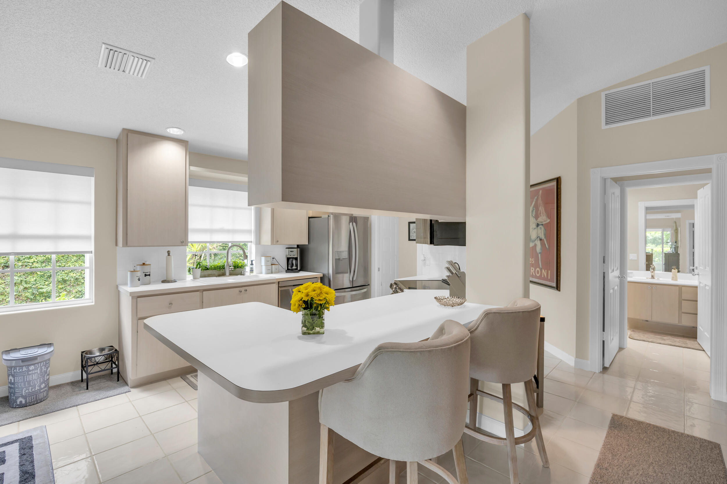 233 Brier Circle Jupiter, FL 33458 - Photo 6 of 31 a view of a dining table and chairs in a room