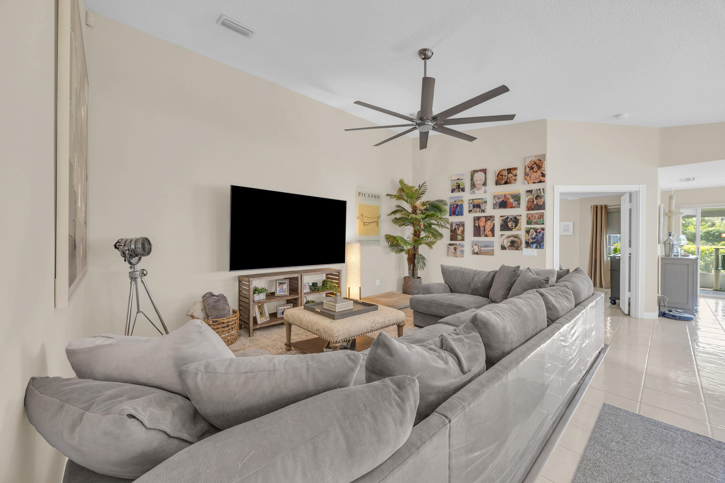 233 Brier Circle Jupiter, FL 33458 - Photo 7 of 31 a living room with furniture and a flat screen tv