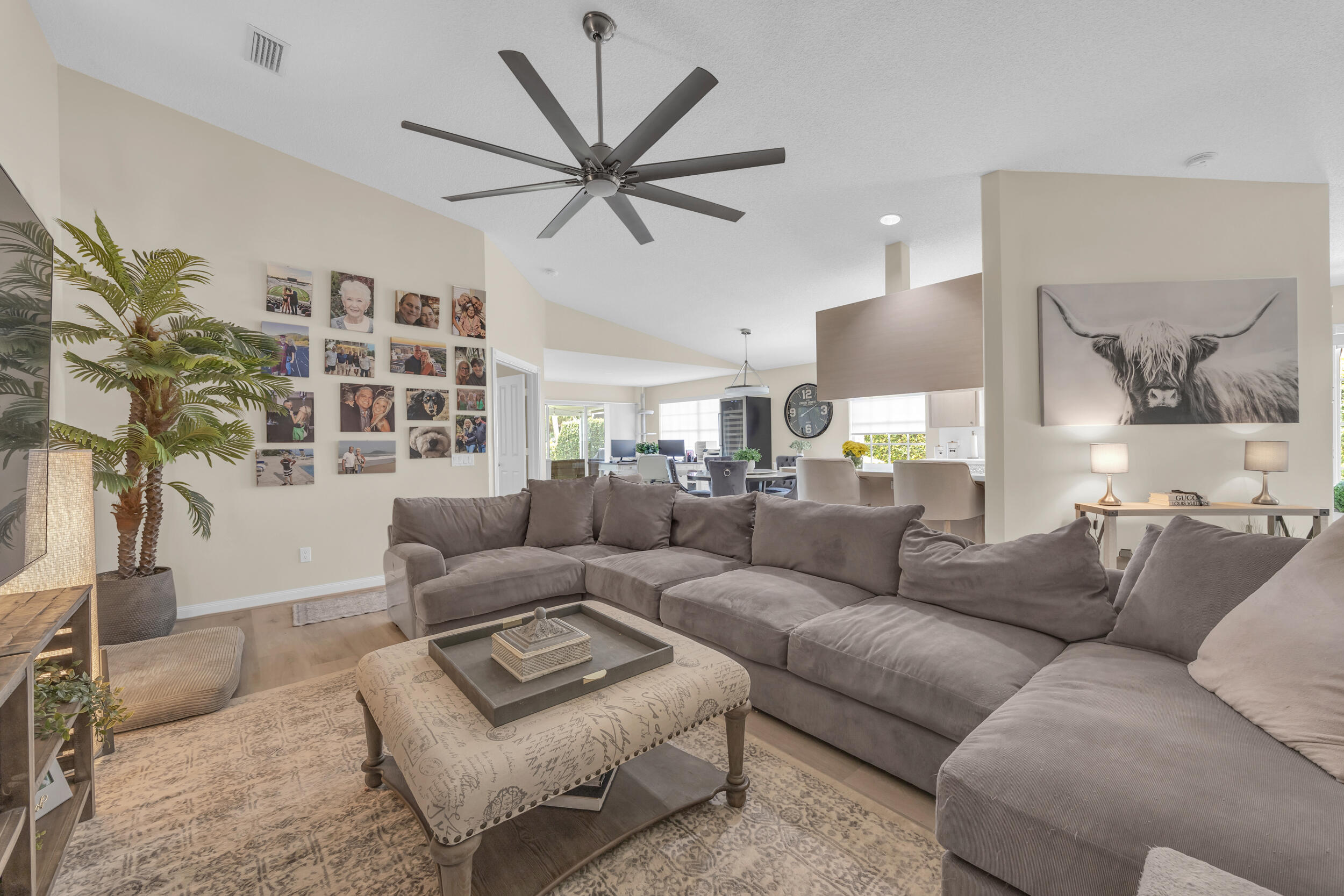 233 Brier Circle Jupiter, FL 33458 - Photo 8 of 31 a living room with furniture and a large window
