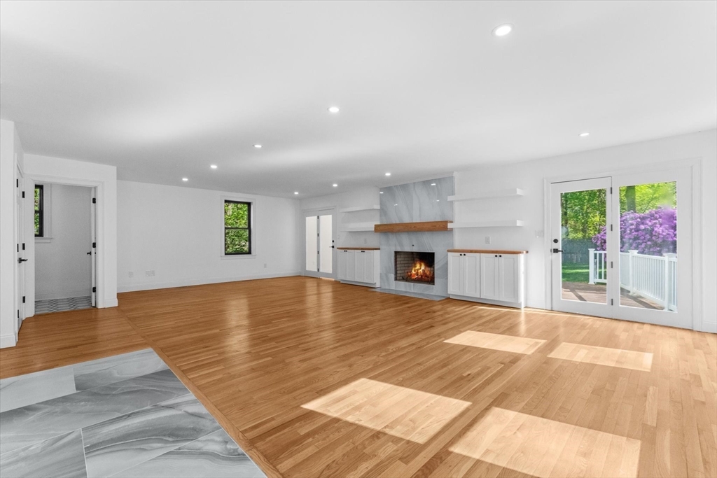 7 Garden Road Wellesley, MA 02481 - Photo 12 of 39 a view of an empty room with a fireplace and a window