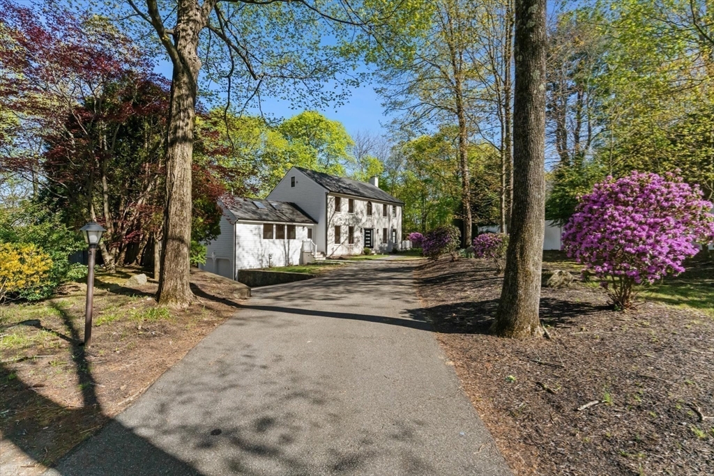 7 Garden Road Wellesley, MA 02481 - Photo 2 of 39 a view of a house with a yard and garage