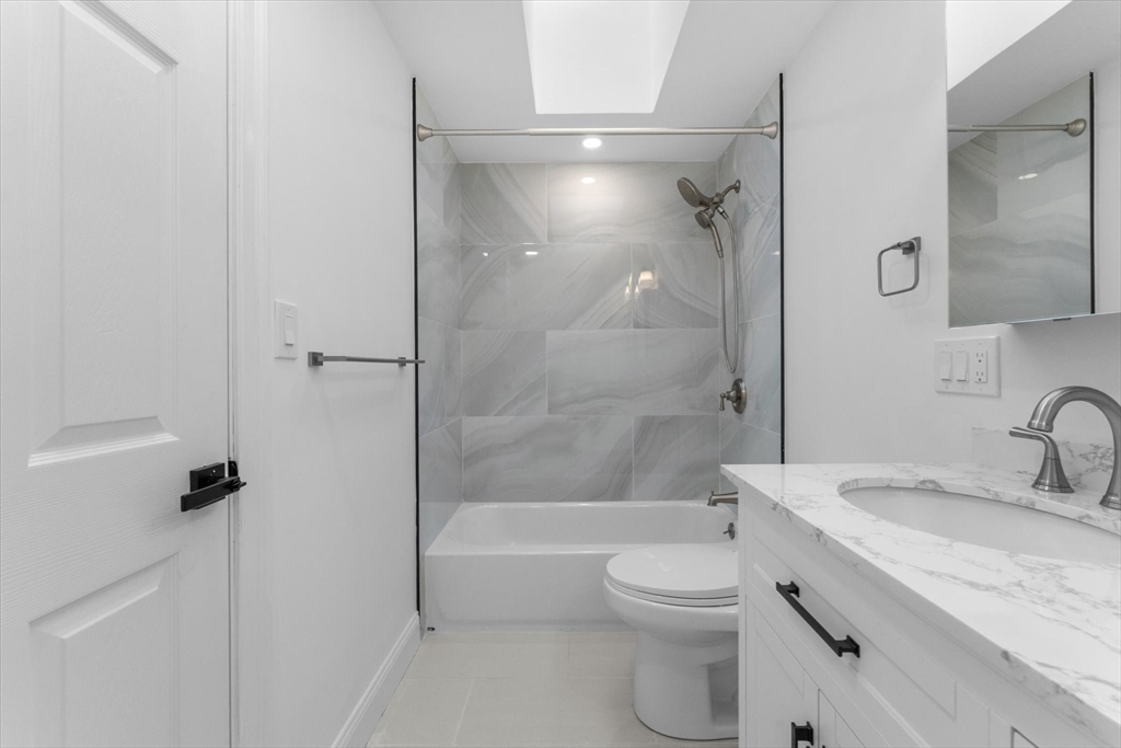 7 Garden Road Wellesley, MA 02481 - Photo 32 of 39 a bathroom with a granite countertop sink a toilet and shower