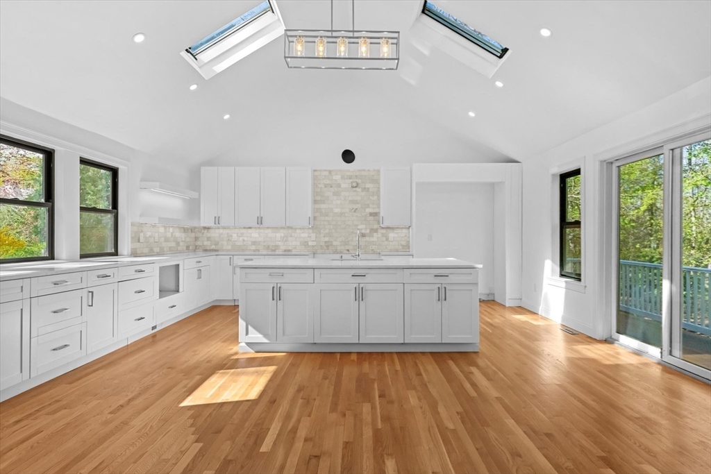7 Garden Road Wellesley, MA 02481 - Photo 7 of 39 a large white kitchen with a large window a oven and white appliances