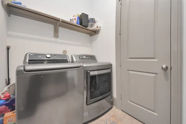 a stove top oven sitting inside of a kitchen